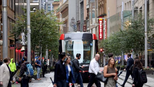 SYDNEY, AUSTRALIA - NewsWire Photos MAY 13, 2022:  People pictured on George Street in the Sydney CBD around 8am. Office worker numbers in the CBD on the rise.Picture: NCA NewsWire / Damian Shaw