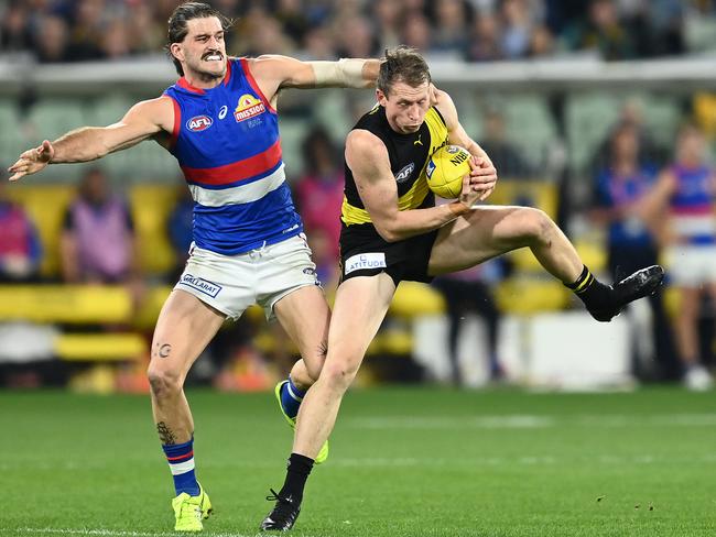 Dylan Grimes omarks in front of Josh Bruce. (Photo by Quinn Rooney/Getty Images)