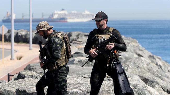 Police divers at Fremantle Harbour during a training session, in sight of the cruise ship Artania, moored off nearby Rottnest Island. Picture: Colin Murty