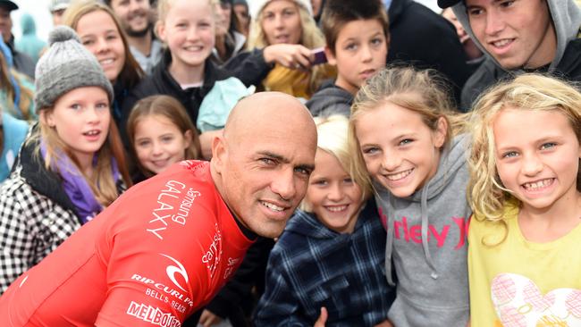 Kelly Slater with groms at last year’s event. Pic: Jason Sammon.