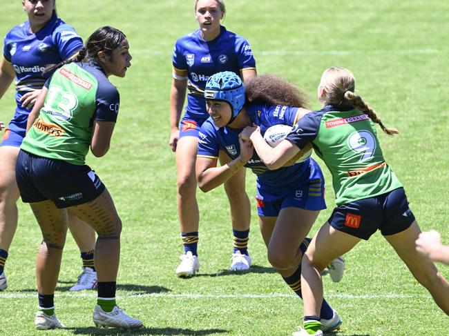 Fontayne Tufuga is tackled by Reese Vidler. Picture: Martin Ollman