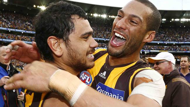 Josh Gibson hugs Cyril Rioli after the 2013 Grand Final. Picture: Michael Klein