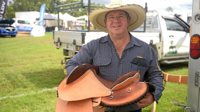 Dallas Dixon donates a saddle to the Paradise Lagoons auction to raise money for rural rescue services. Picture: Jann Houley