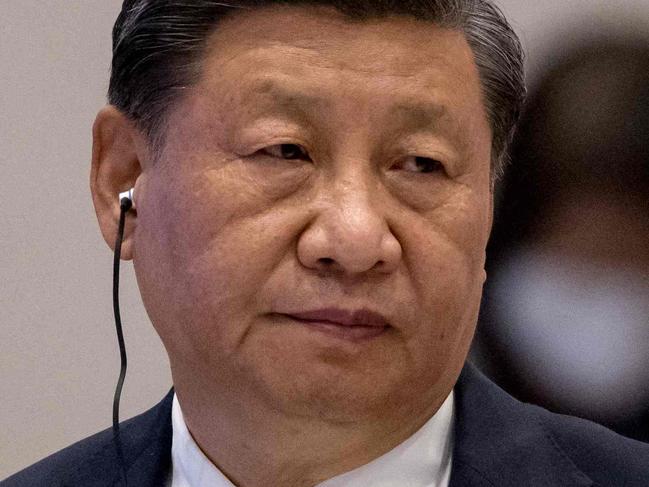 China's President Xi Jinping looks on during the handover ceremony at the Asia-Pacific Economic Cooperation (APEC) summit in Bangkok on November 19, 2022. (Photo by Jack TAYLOR / AFP)