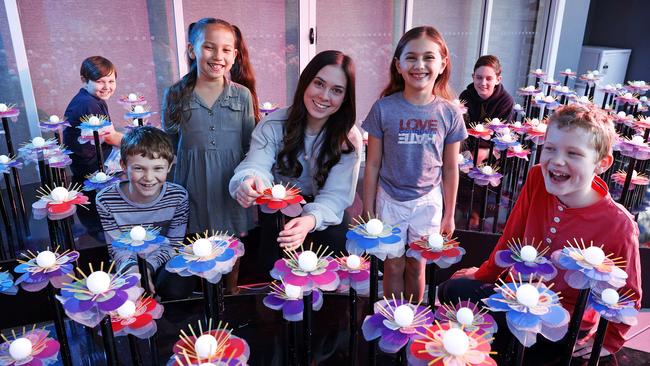 Artist Gemma Ferguson is one of the youngest light artists involved in Vivid Sydney. Pictured with Thomas Heppell, Harry Oliver, Avalon Elsley, Ava Corcoran, Henry Wayland and Lachlan Oliver. Picture: Tim Hunter.