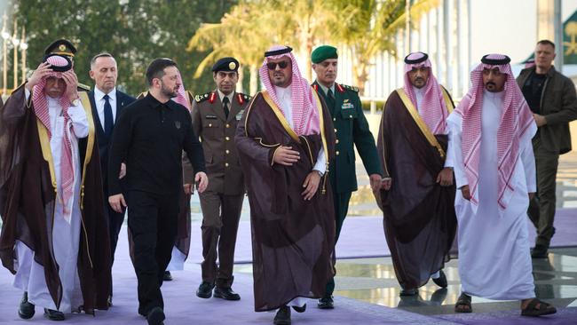 Ukraine's President Volodymyr Zelensky (C-L) is welcomed by Deputy Governor of Makkah Region Prince Saud bin Mishal bin Abdulaziz (C-R) upon his arrival to Jeddah. Picture: AFP