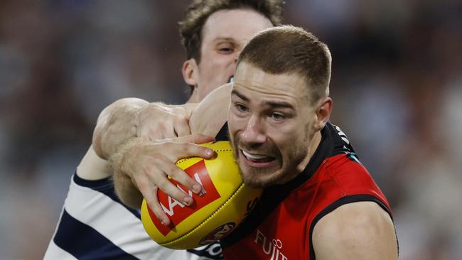 Ben McKay tries to break out of a tackle for Essendon. Picture: Michael Klein