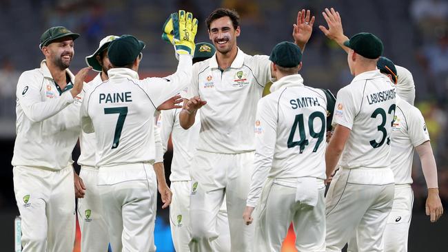 Mitchell Starc is congratulated by teammates late on day four. Picture: AAP