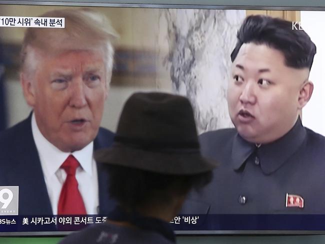 Donald Trump, left, and North Korean leader Kim Jong Un during a news program at the Seoul Train Station in Seoul, South Korea. Picture: AP