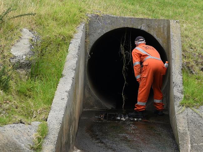 Police and SES conduct a line search at Warner reserve Springvale, hoping to uncover evidence. Picture: Nicole Garmston