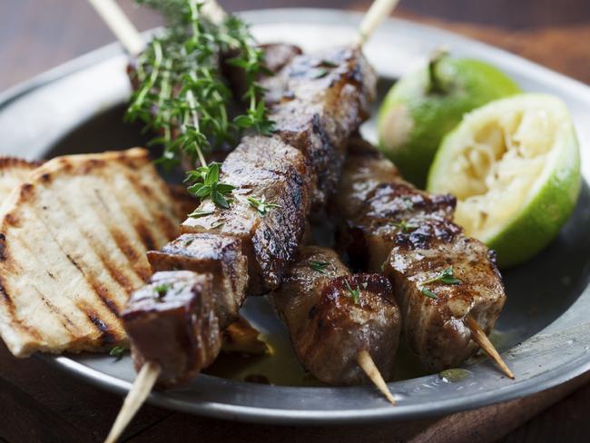 meat skewer with herbs, lime and pita bread