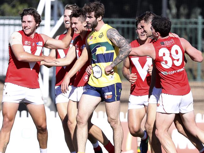 29/04/18 - SANFL - Eagles v North Adelaide at Woodville Oval. Jack Firns not impressed about being in the middle of North's goal celebrations . Picture SARAH REED