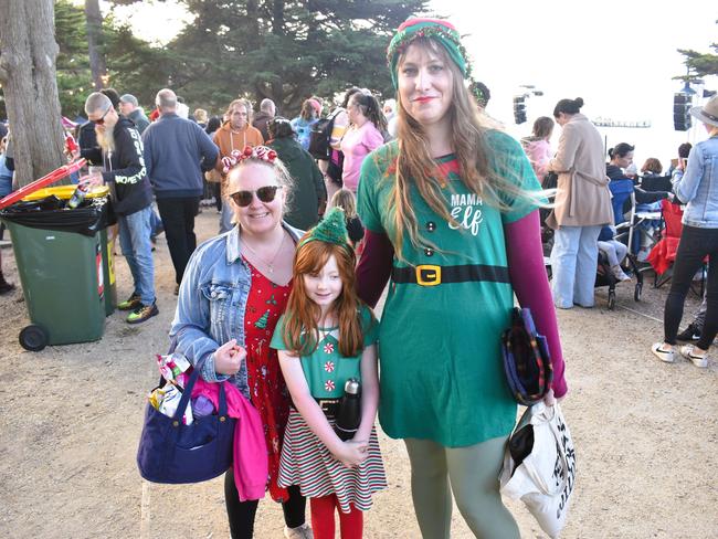 Shannon Dollery, Luna and Katie Hart getting festive at the Phillip Island Christmas Carols by the Bay at the Cowes Foreshore on Tuesday, December 10, 2024. Picture: Jack Colantuono