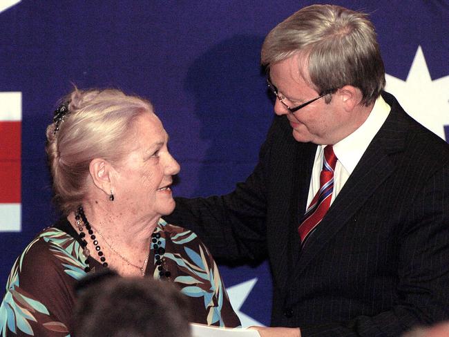 And here she is again in 2007 receiving an award from Ruddy. Picture: Richard Walker