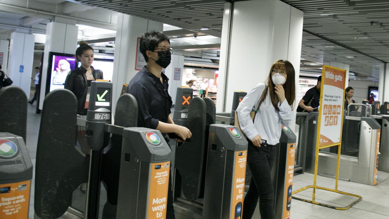 Mask are commonly now being worn around the Sydneys CBD due to the fear of the Coronavirus. Photo: Tim Pascoe