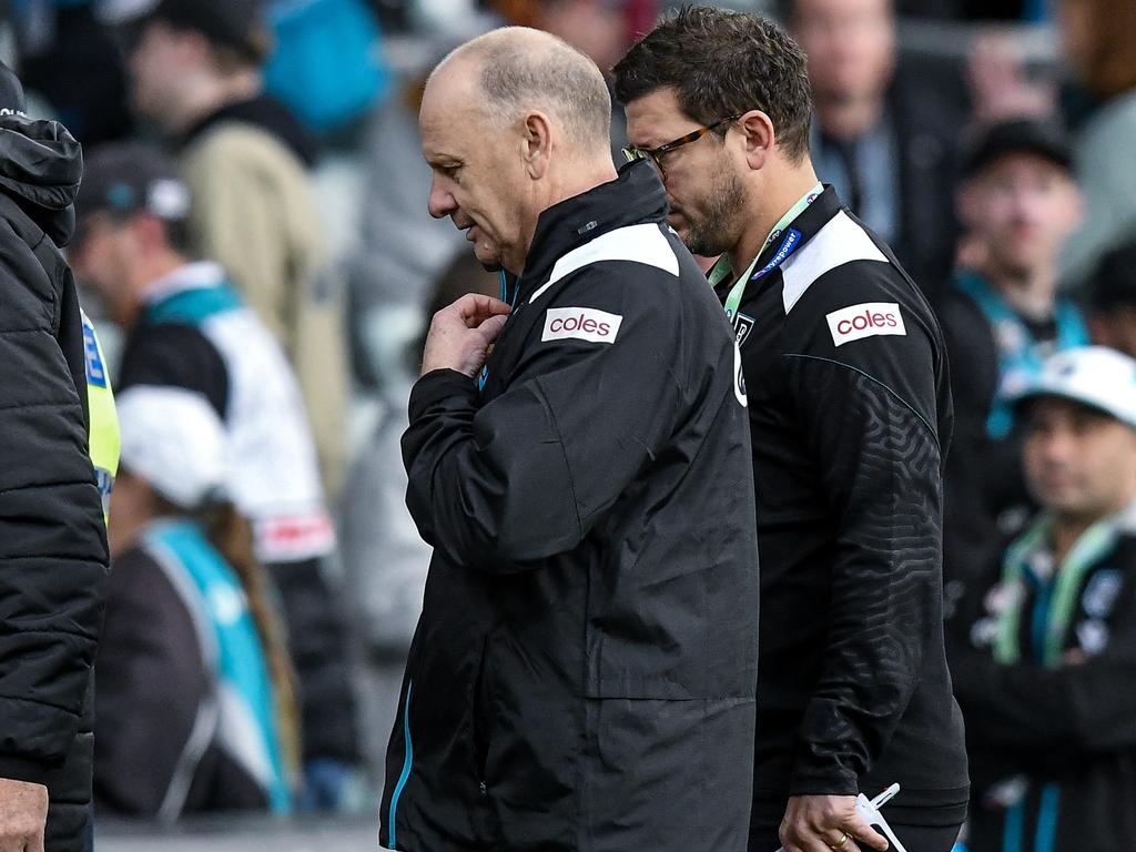 Ken Hinkley walks off Adelaide Oval on Saturday with Josh Carr. Picture: Mark Brake/Getty Images