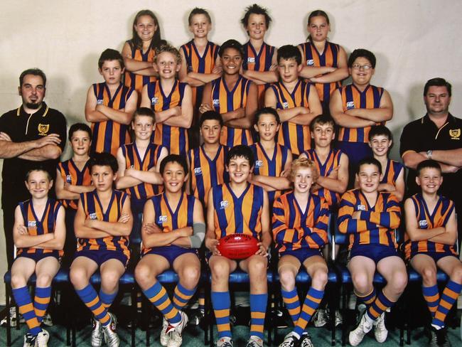 Treloar (second from left, third row) with his Noble Park under-12 side in 2005. Collingwood VFL’s Alex Woodward is third from the left in the front row.