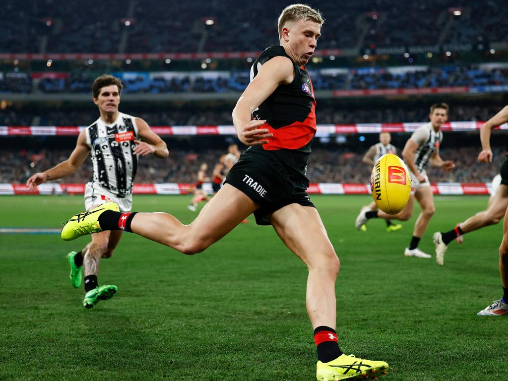 MELBOURNE, AUSTRALIA - JULY 05: Nate Caddy of the Bombers kicks the ball during the 2024 AFL Round 17 match between the Collingwood Magpies and the Essendon Bombers at Melbourne Cricket Ground on July 05, 2024 in Melbourne, Australia. (Photo by Michael Willson/AFL Photos via Getty Images)