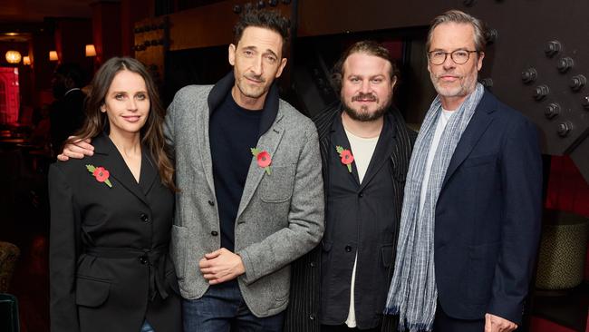 Felicity Jones with Adrien Brody and Guy Pearce at a special BAFTAs screening of The Brutalist.