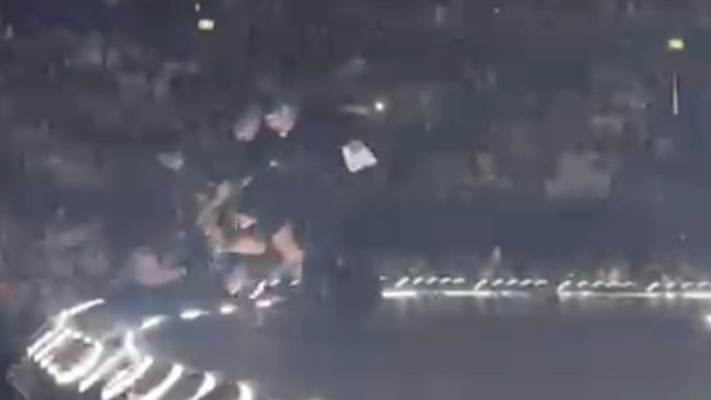Security guards forcibly remove a fan from the stage at a Katy Perry concert at Qudos Bank Arena on June 9, 2024. Picture: Supplied