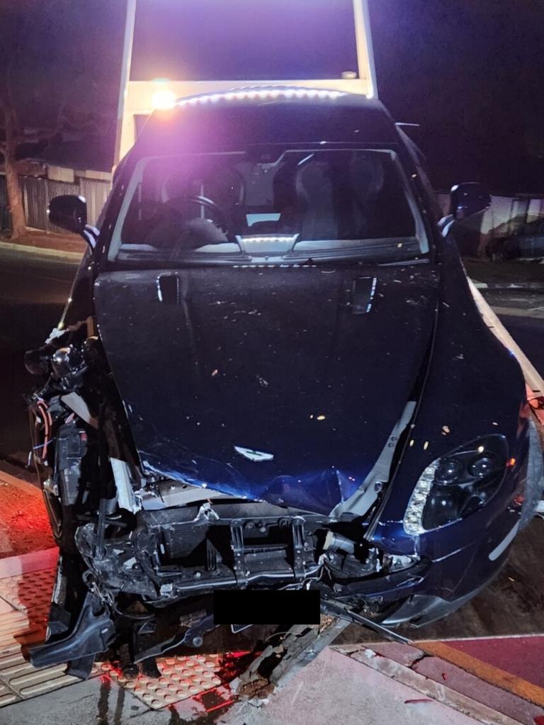 A driver will appear in court after crashing his luxury sports car into a bus stop at Gilles Plains after the car was allegedly seen leaving a hotel car park at speed. Picture: SA Police