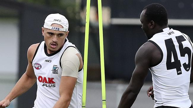 CASE CLOSED. Port Adelaide midfielder Sam Powell-Pepper, left, is clear to play in the AFL again after completing a three-game ban by missing the clash with North Melbourne on Saturday. Picture: Sarah Reed