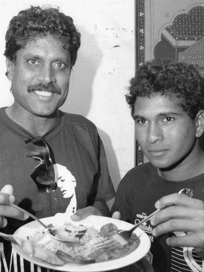 Indian cricketers Kapil Dev (left) and Sachin Tendulkar warmed to the taste of home at a special curry dinner at Jasmin restaurant in Adelaide in 1992. Picture: File