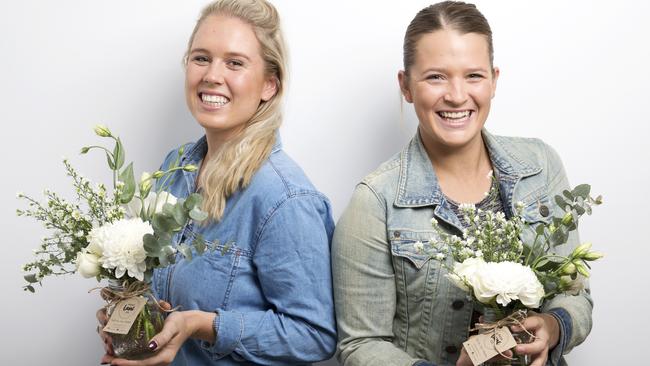 Cousins Riley Maynard and Chandler Searle from Posy Lane Co. know how to put a smile on your dial. Picture: NIGEL HALLETT