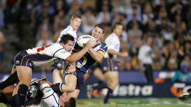 Corey Parker and Shane Webcke tackle Luke O’Donnell