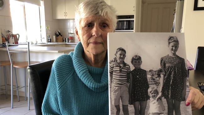 Murder victim Linda Stilwell's mother Jean Priest with a photo of four of her children: Gary, Linda, Louise and Karen.