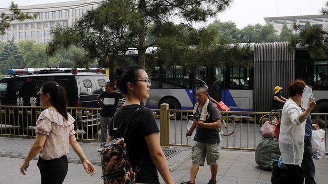 Ren Liping in Beijing at the police headquarters to file a petition to have her case re-examined.Picture: AP Photo/Andy Wong