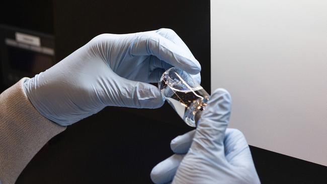 A vial of the drug remdesivir is inspected at a Gilead manufacturing site in the US. Picture: AP