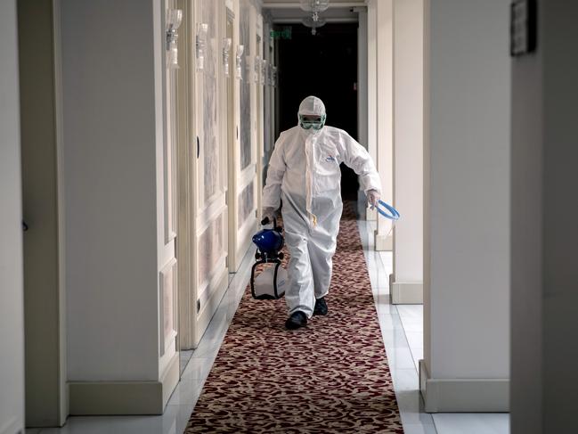 ISTANBUL, TURKEY - JULY 04: A hotel employee carrying a disinfecting spray is seen in a hallway of Istanbul's historic Pera Palace Hotel on July 04, 2020 in Istanbul, Turkey. After being closed for more than three months the famous hotel reopened on June 26th under new coronavirus restrictions. After each stay rooms are cleaned and disinfected and left for 12 hours before new guests can enter, air conditioning units were altered with new filters, masks and hand sanitizer are supplied throughout the hotel. The hotel was built in 1892 for the purpose of hosting passengers of the Orient Express and it is the oldest European hotel in Turkey. The hotel hosted writers, politicians, and film stars including Winston Churchill, Alfred Hitchcock, Zsa Zsa Gabor, Ernest Hemingway and Greta Garbo. Room 411 is the Agatha Christie room where it is said she wrote "Murder on the Orient Express"  and Room 101, was the favorite chambers of Mustafa Kemal Ataturk, the founder of modern Turkey, has been made into a museum. On July 03, the UK government announced the lifting of travel bans to Turkey allowing summer holiday travel between the two countries without quarantine restrictions from July 10, 2020.  (Photo by Chris McGrath/Getty Images)