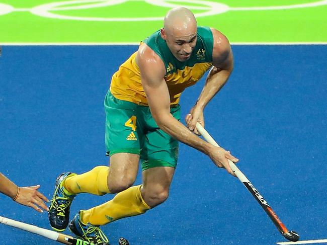 RIO DE JANEIRO, BRAZIL - AUGUST 09: Glenn Turner #4 of Australia moves the ball past Emmanuel Stockbroekx #15 of Belgium during the hockey game on Day 4 of the Rio 2016 Olympic Games at the Olympic Hockey Centre on August 9, 2016 in Rio de Janeiro, Brazil. (Photo by Christian Petersen/Getty Images)