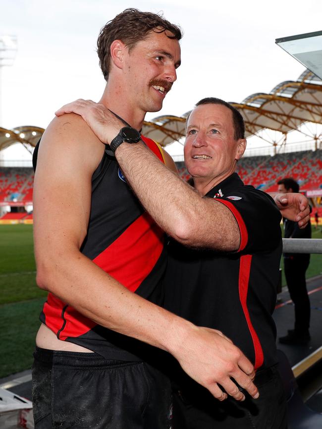 Joe Daniher embraces John Worsfold after what could prove to be both of their last games with Essendon.