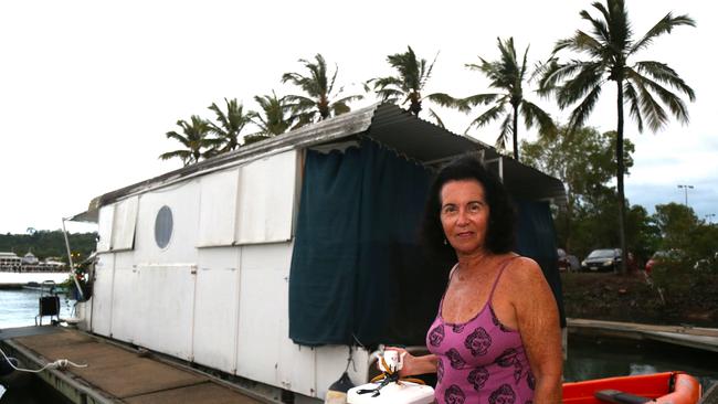 Former Hollywood stunt woman Tiffiny Lynn remains defiant against the storm on-board her house boat tied up outside the Port Douglas Yacht Club. Picture: Peter Carruthers