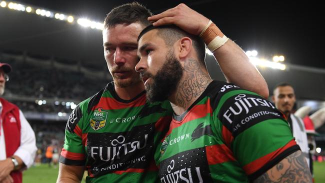 Damien Cook (left) and Adam Reynolds of the Rabbitohs embrace falling their loss to the Roosters in the NRL Preliminary Final match between the Sydney Roosters and the South Sydney Rabbitohs at Allianz Stadium in Sydney, Saturday, September 22, 2018. (AAP Image/Dan Himbrechts) NO ARCHIVING, EDITORIAL USE ONLY