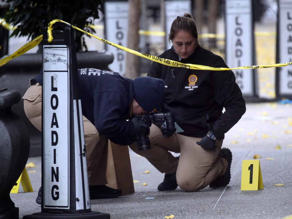 Police collect evidence outside the Hilton Hotel in Midtown Manhattan where United Healthcare CEO Brian Thompson was fatally shot. Picture: Spencer Platt/Getty Images/AFP