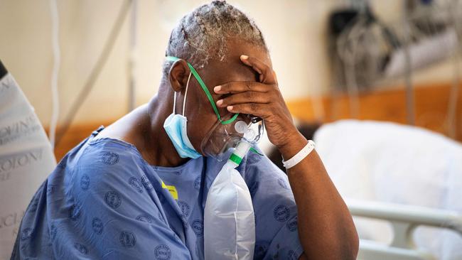 A COVID-19 patient breaths in oxygen in Khayelitsha Hospital, about 35km from the centre of Cape Town, South Africa. Picture: AFP