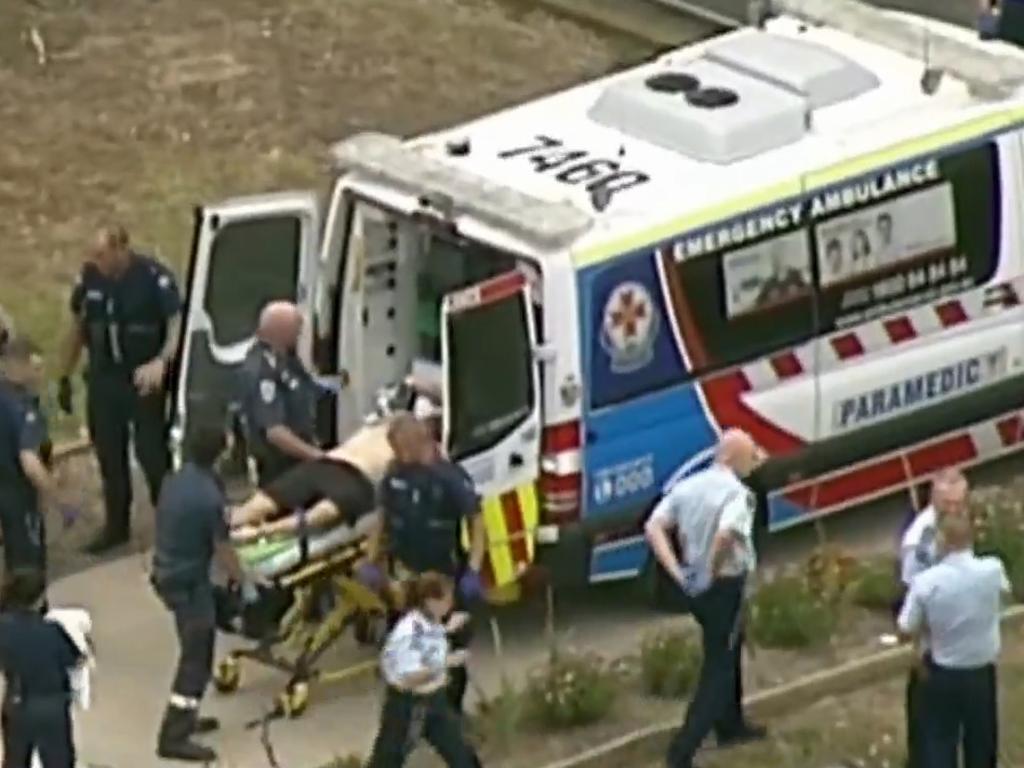 Paramedics work on a critically injured Tony Mokbel at Barwon prison. Picture: Seven News