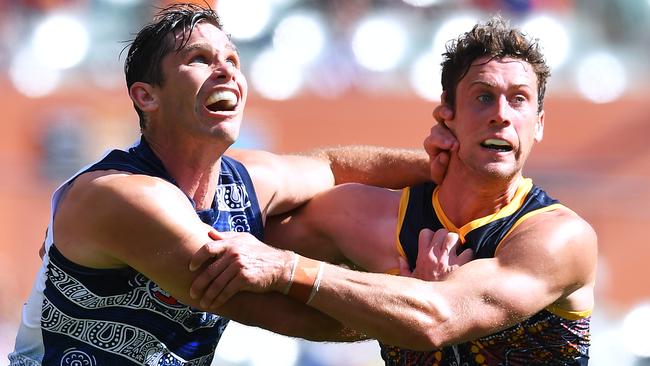 Tom Hawkins competes with Kyle Hartigan during the Cats’ win. Picture: Mark Brake/Getty