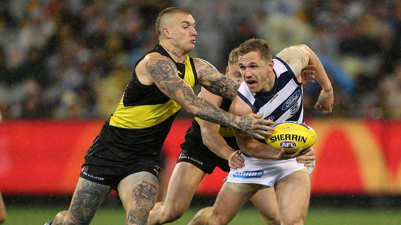 Joel Selwood is tackled by Dustin Martin on Friday night.