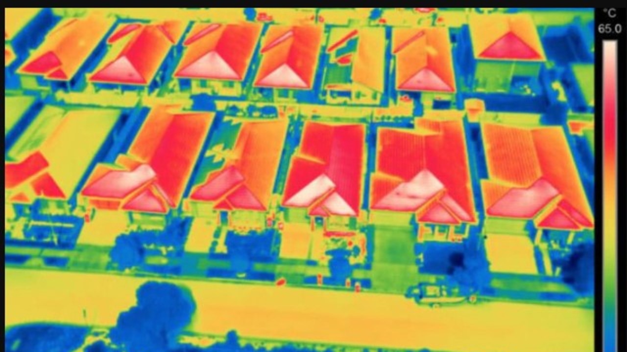 Thermal imaging of houses in a Penrith suburb during a heatwave shows how hot dark roofs can get.