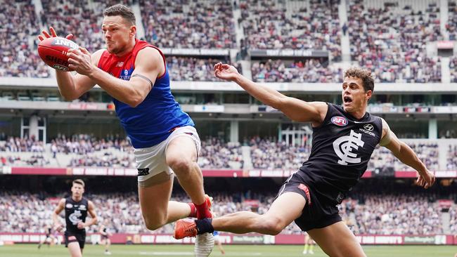 Demon Steven May marks under pressure from Carlton’s Ed Curnow. Picture: Michael Dodge/Getty