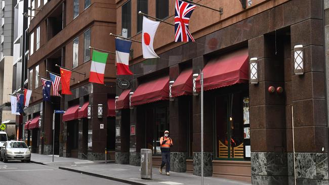 A man walks past the Stamford Plaza Hotel, used as an isolation hotel from returned travellers from overseas in Melbourne. Picture: William West/AFP