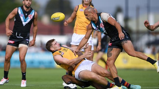 Mark Keane of the Crows is floored by Sam Powell-Pepper (Photo by Mark Brake/Getty Images)