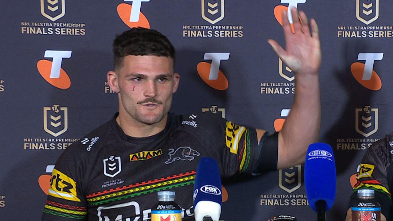 Nathan Cleary lifts his arm up to prove his shoulder is fine.