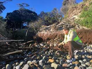 DAMAGE: Group Manager of Operations Steve Bennett inspecting the debris on Clarkes Beach.