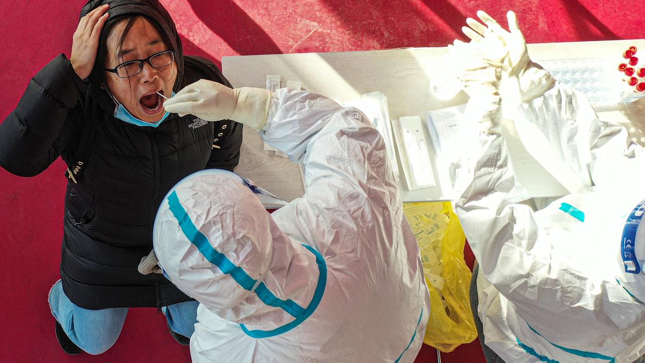 Health worker swabs resident in Shenyang, in China's northeast Liaoning province on January 2. Picture: STR/ AFP