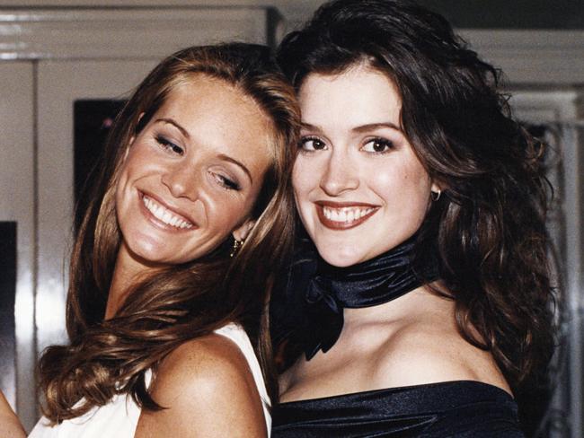 Fischer poses with fellow model Elle Macpherson in 1994.